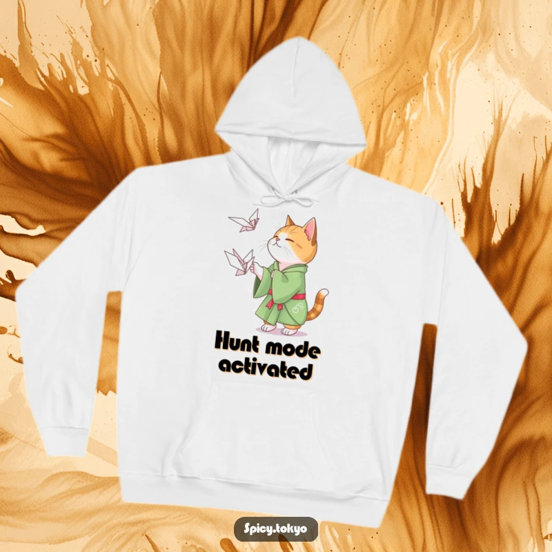 Funny cat in a green kimono playfully attempting to catch a floating origami crane, a cozy and humorous gift.